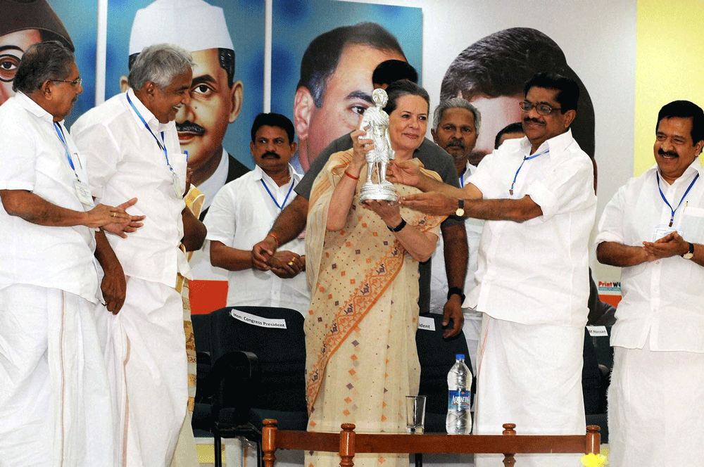 Thiruvananthapuram : Congress President Sonia Gandhi receiving a memento from Kerala Congress President V M Sudheeran after addressing a special convention of the party's state unit at the party office in Thiruvananthapuram on Tuesday. PTI Photo