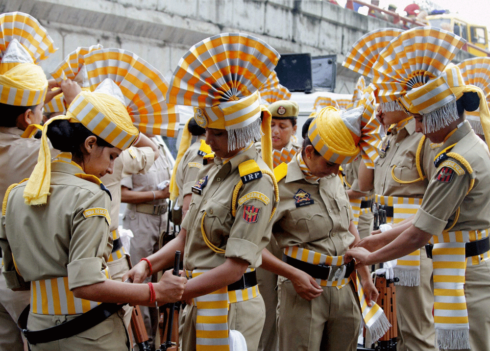 Jammu: Women police officers getting ready to take part in the full dress rehearsal of 68th Independence Day parade at parade ground in Jammu on Wednesday. PTI Photo