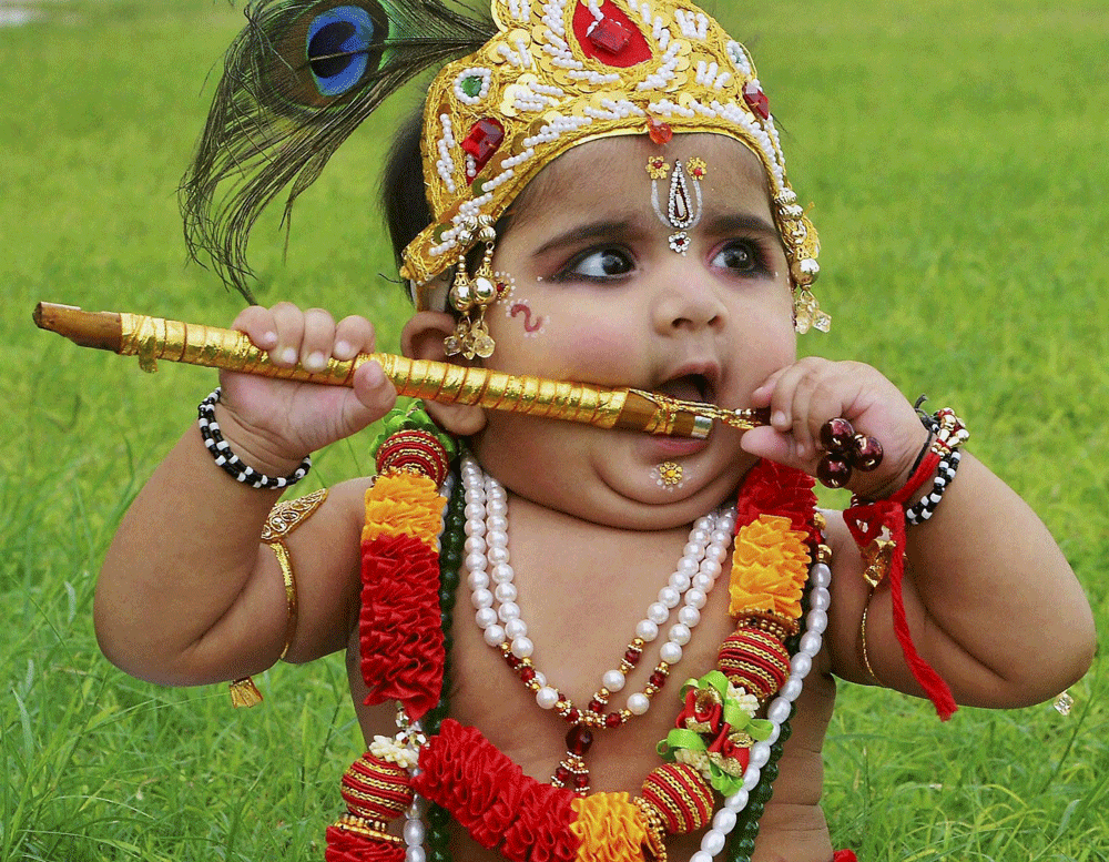 Jaipur: A child dressed up as Lord Krishna participates in 'Bal Gopal' contest on the occasion of Janamashtami festival in Jaipur on Sunday. PTI Photo