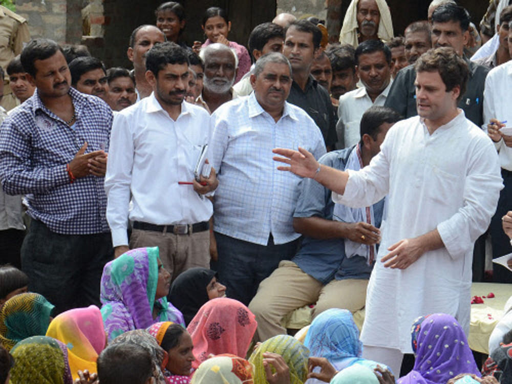 Congress Vice President Rahul Gandhi interacts with village women during a visit in his parliamentary constituency Amethi on Thursday