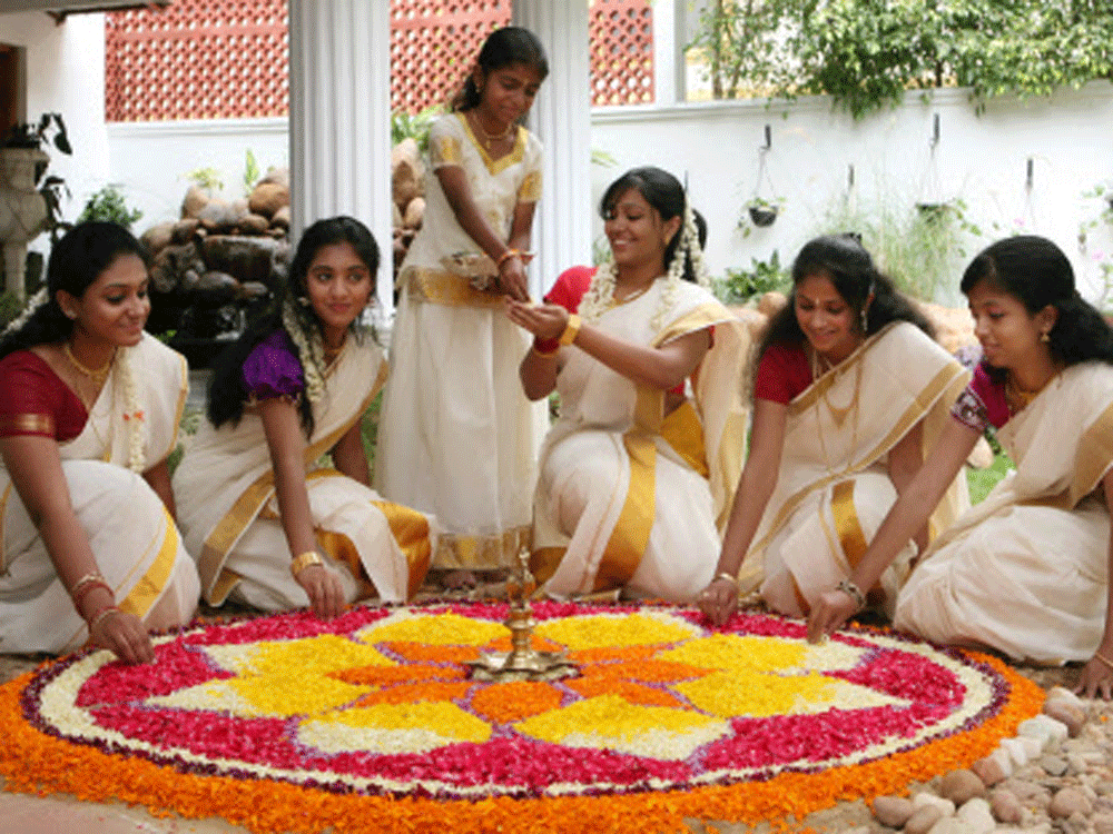 Keralities are celebrating ONAM by making Pookkalam at a house at Viveknagar in bangalore on Saturday. DH Photo.