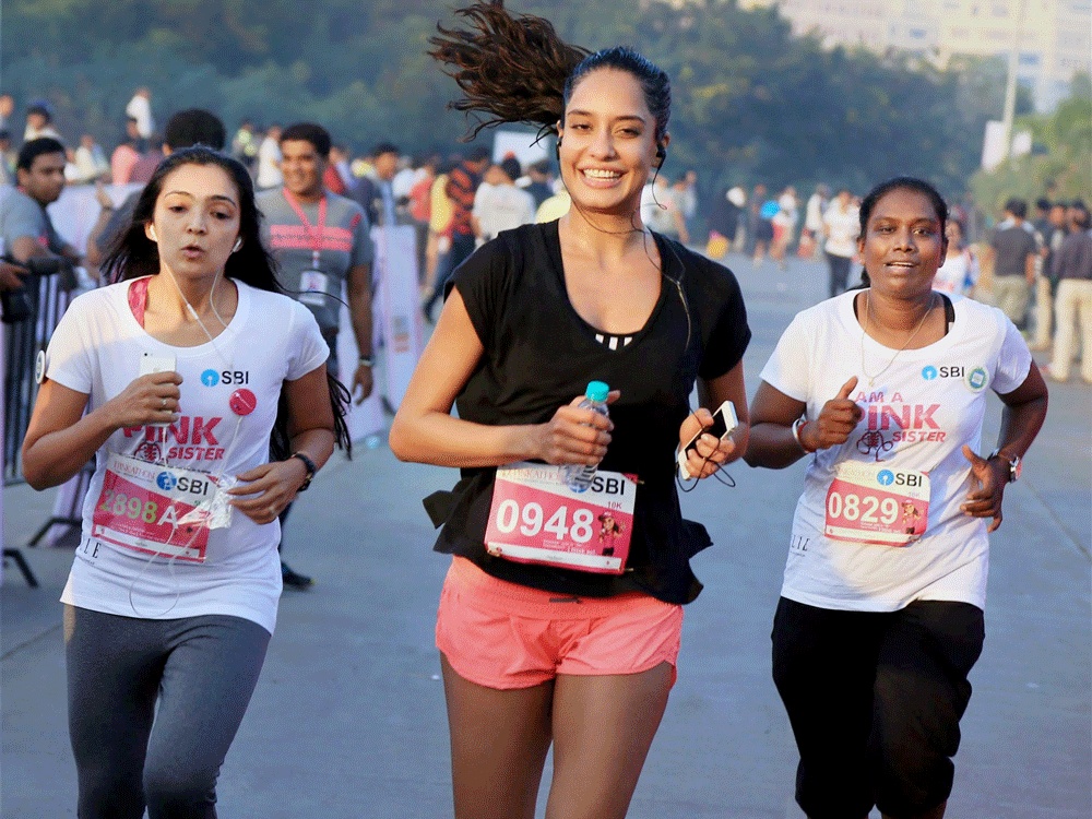  Bollywood Actress Lisa Haydon participate in a Marathon to create awareness about breast cancer in Mumbai on Sunday. PTI Photo