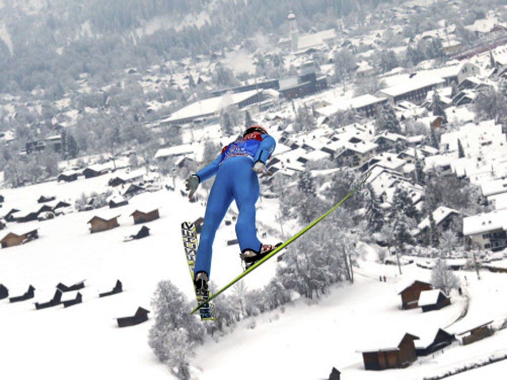 Stefan Kraft from Austria soars through the air during the practice for the second jumping of the 63rd four-hills ski jumping tournament in Garmisch-Partenkirchen, southern Germany, December 31, 2014. The prestigious four-hills tournament will end in...