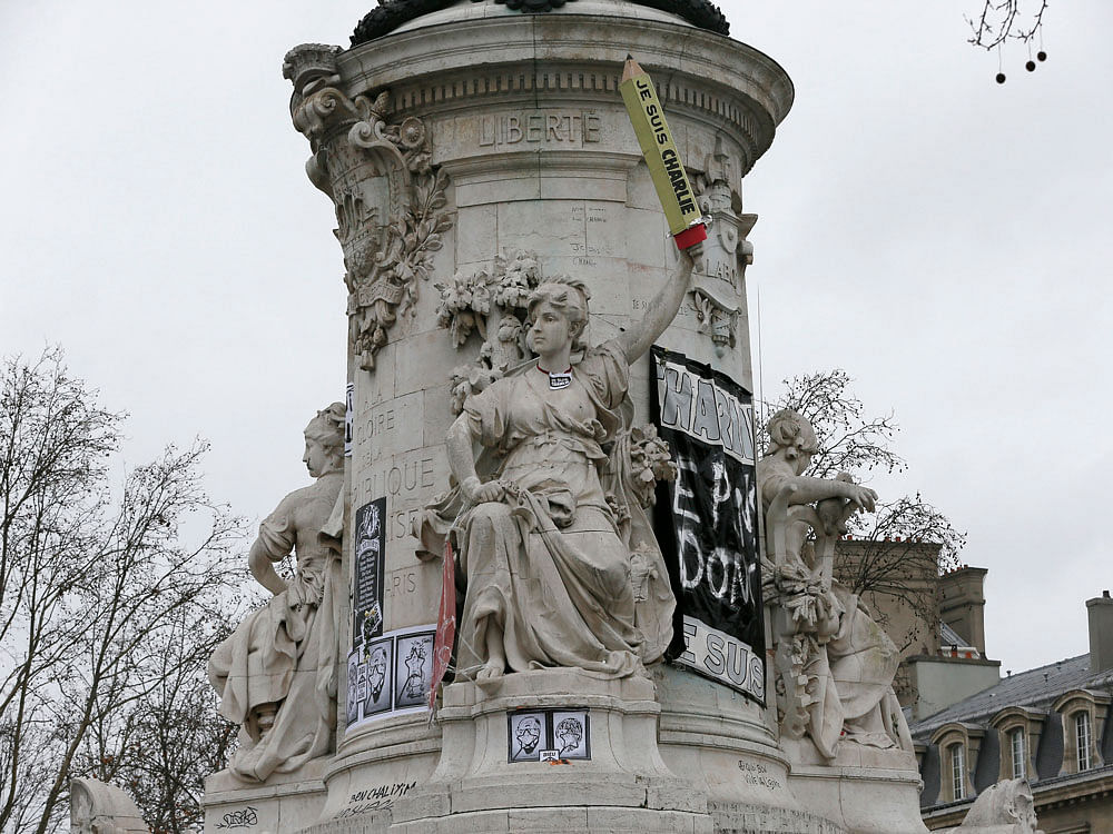 The statue at the Place de la Republique in Paris is seen featured with a giant cardboard pencil reading 'I'm Charlie' Reuters Photo