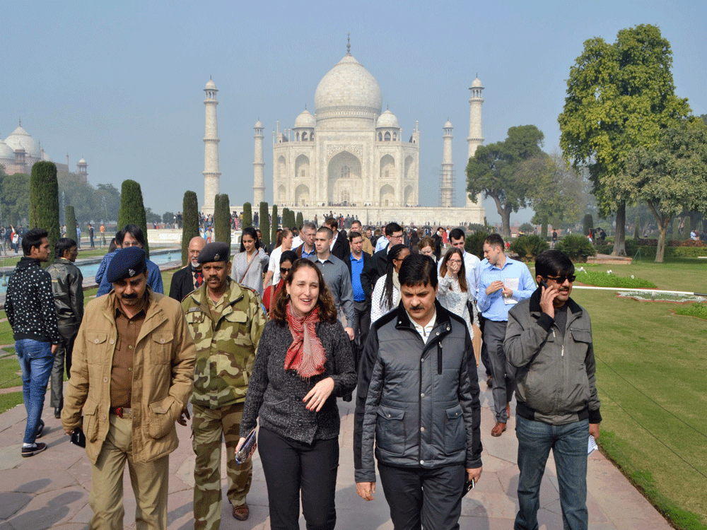 U.S. President Barack Obama's advance team review the Taj Mahal monument with Archaelogical Survey of India (ASI) chief Navratan Kumar Pathak, foreground right, in Agra, India, Monday, Jan. 19, 2015. Obama is scheduled to visit India later this week ...