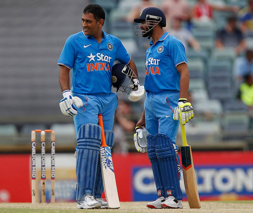 MS Dhoni, left, and team mate Ravindra Jadeja speak during their one-day international crick