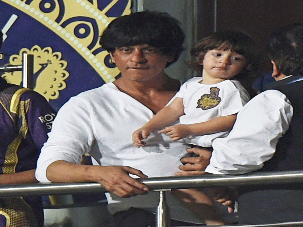  KKR owner Bollywood actor Shah Rukh Khan cheers his team during IPL 2015 first match against Mumbai Indians at Eden Garden in Kolkata on Wednesday. PTI Photo