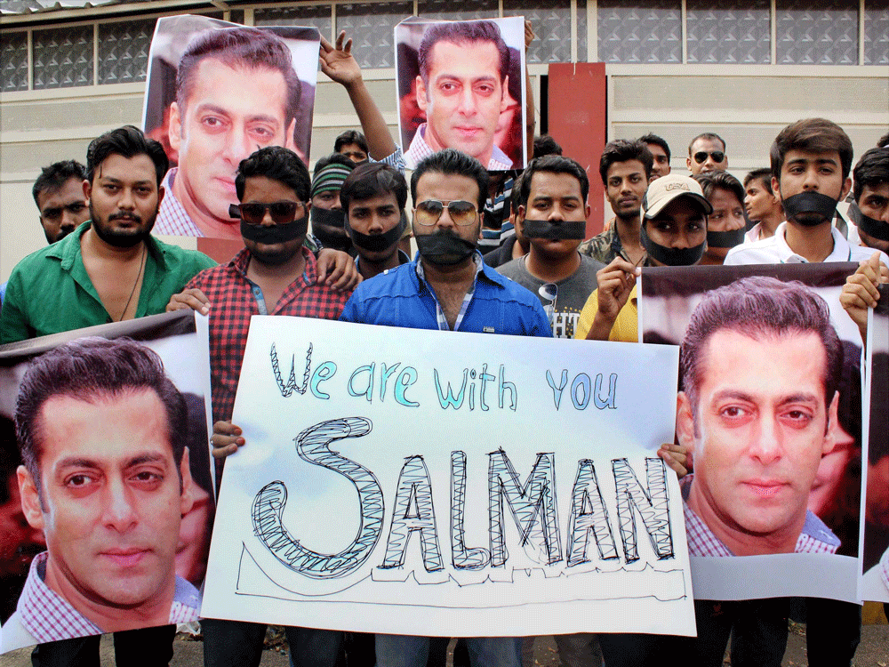 Fans of Bollywood actor Salman Khan at a silent march to support him after a court sentenced him to 5 years jail in 2002 hit-and-run case, in Nagpur on Wednesday. PTI Photo.