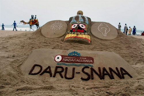 :  Sand artist Sudarsan Pattnaik has created a sand sculpture of Lord  Jagannath on the occasion of Devasnana Purnima at Puri beach of Odisha  on Monday. PTI Photo