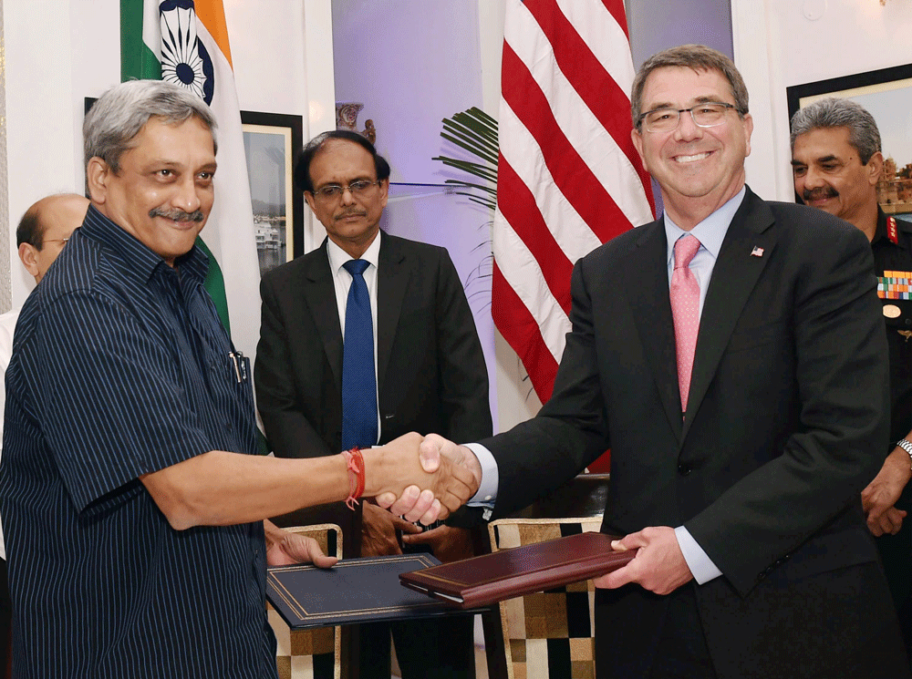 Defence Minister Manohar Parrikar shakes hands with US Secretary of Defence Ashton Carter after an MoU signed in New Delhi on Wednesday. PTI Photo