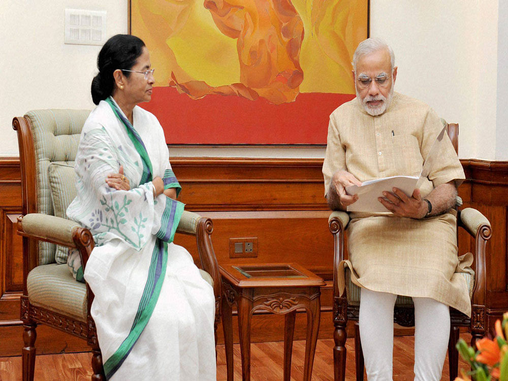 Prime Minister Narendra Modi with Chief Minister of West Bengal, Mamata Banerjee in a meeting in New Delhi on Wednesday. PTI Photo.