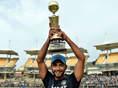  India 'A' skipper Unmukt Chand holds the winning trophy after the final match of 'Triangular Series' against Australia 'A' at the at MAC Stadium in Chennai on Friday. PTI Photo