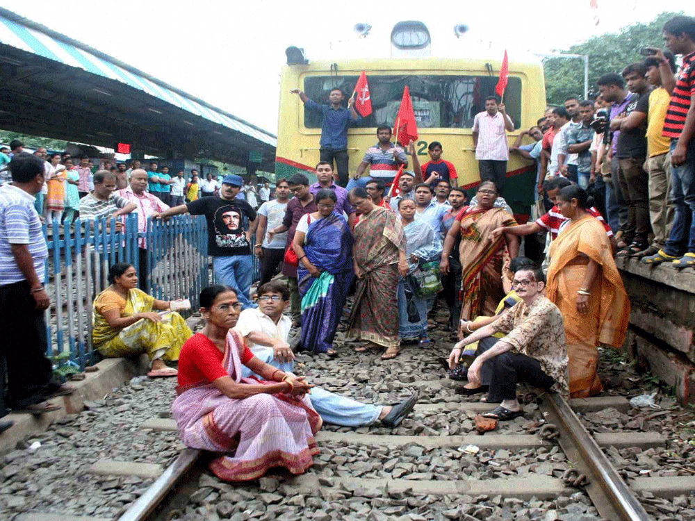 Bandh supporters blocked railway track at Sodepur Station in North 24 Pargana district of West Bengal on Wednesday during trade union nationwide strike. PTI Photo.