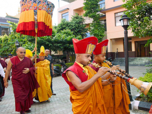 17th Karmapa Ogyen Trinley Dorje being welcome by Buddhist Monks at Tergar monastry in Bodhgaya on Friday. PTI Photo.