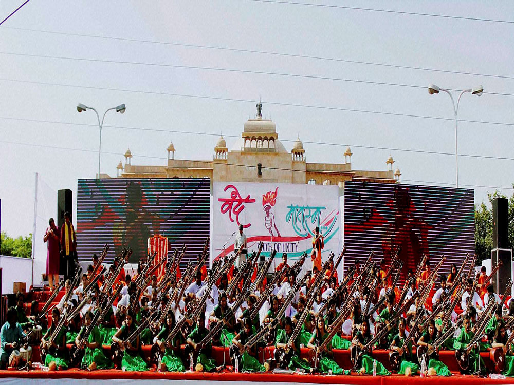 Students sing 'Vande Mataram' in a bid to create a world record at Janpath road in Jaipur on Tuesday. PTI Photo