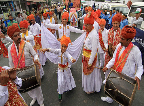 Artists performs during the inauguration of Navratar festival at Katra on Tuesday. Artists performs during the inauguration of Navratar festival at Katra on Tuesday. PTI Photo