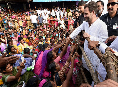 Congress Vice President Rahul Gandhi meets flood affected people at Mudichur in Chennai on Tuesday. PTI Photo