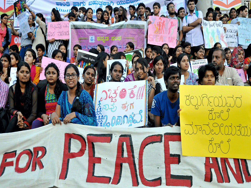 St Josephs College of Commerce Students and Youth for Peace and Plurality members staging a peaceful protest condemning the killing of Prof Kalburgi and demanding for the right to lead a peaceful life, in front of Town Hall in Bengaluru on Thursday. ...