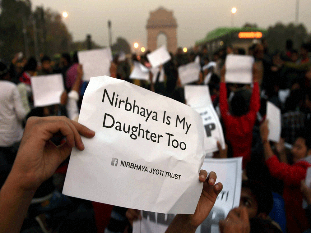  A poster during the protest against release of juvenile convict in the Dec 16 gangrape victim at India Gate in New Delhi on Sunday. PTI Photo.