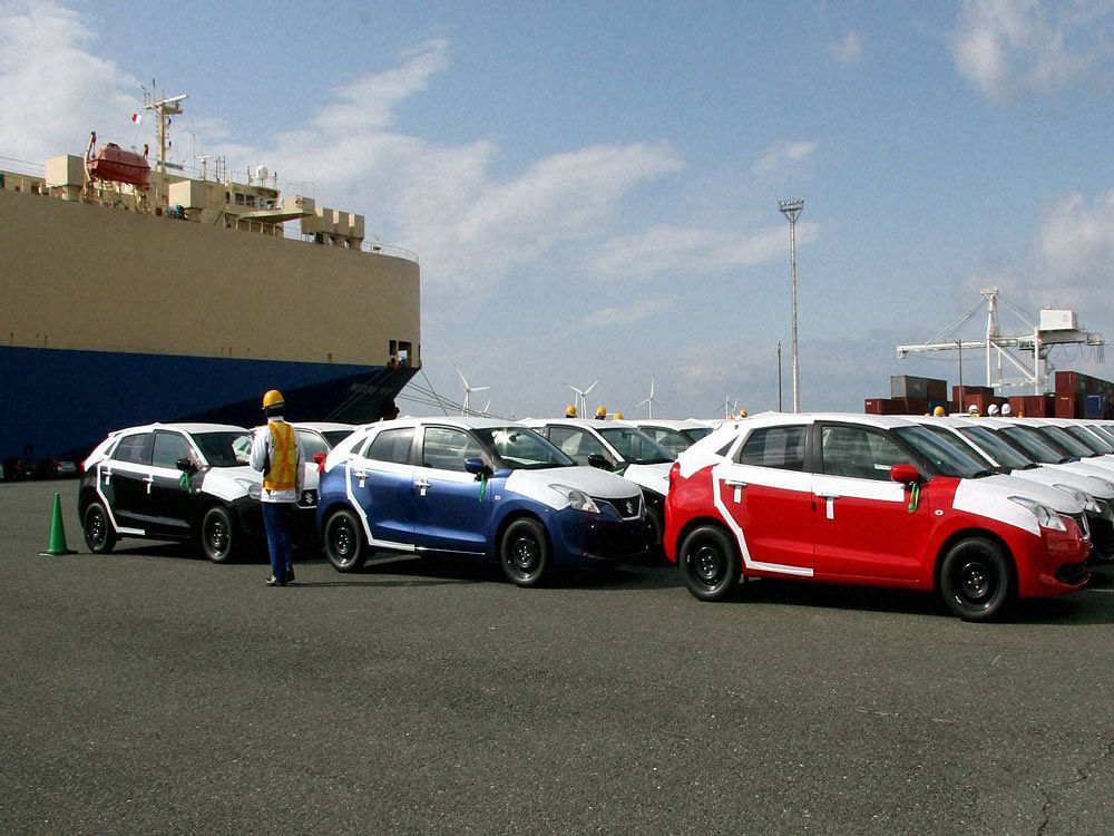 Made in India Suzuki Baleno gets unloaded at Toyohashi Port Japan. This first lot of Balenos, manufactured at Maruti Suzuki’s Manesar plant, was exported to Japan in January. PTI Photo.