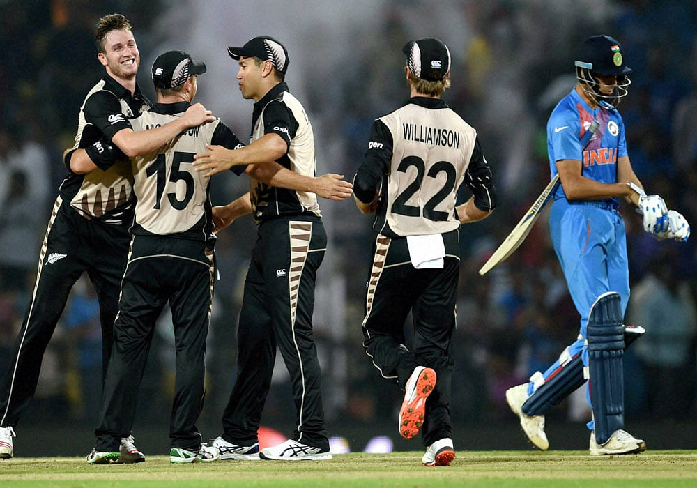 New Zealand players celebrate their victory against India during the ICC T20 World Cup match played in Nagpur on Tuesday. PTI Photo by Shashank Parade