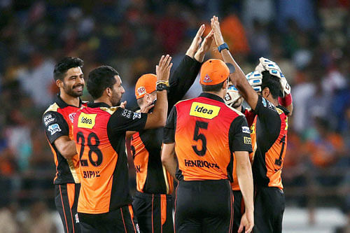 Bhuvneshwar Kumar of Sunrisers Hyderabad is congratulated for dismissing Aaron Finch of Gujarat Lions during their IPL match in Rajkot on Thursday. PTI Photo