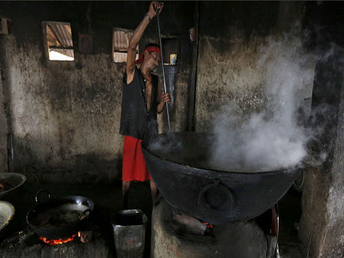 A man prepares food inside a community kitchen at a Hindu temple on the banks of the river Ganga in Kolkata. REUTERS/Rupak De Chowdhuri