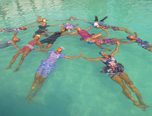 Girls doing yoga in water on 2nd World Yoga Day in Ajmer on Tuesday. PTI Photo