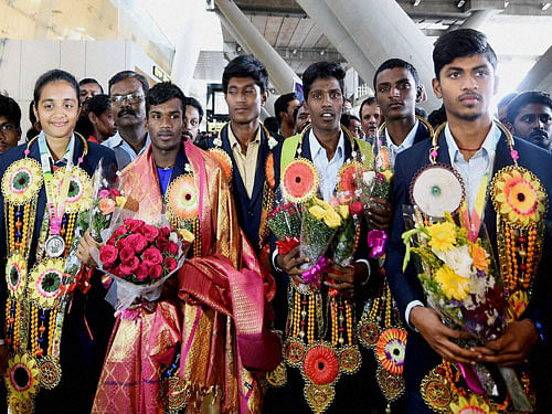The 9 athletes from Tamilnadu, among the 148 others from India, who were in Turkey to participate in the world school Olympics, return safely at Kamaraj Domestic Airport in Chennai on Tuesday. PTI Photo