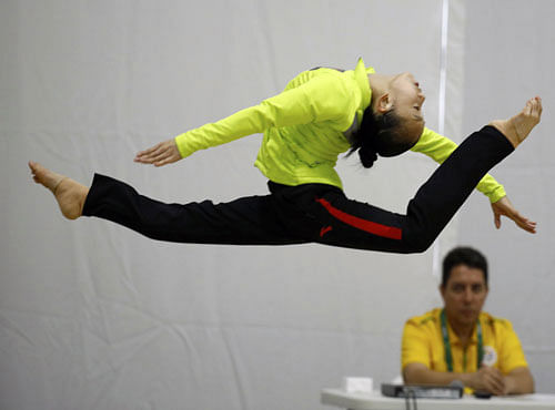  Rio de Janeiro, Brazil - 02/08/2016. A Team China's gymnast during floor practice. REUTERS