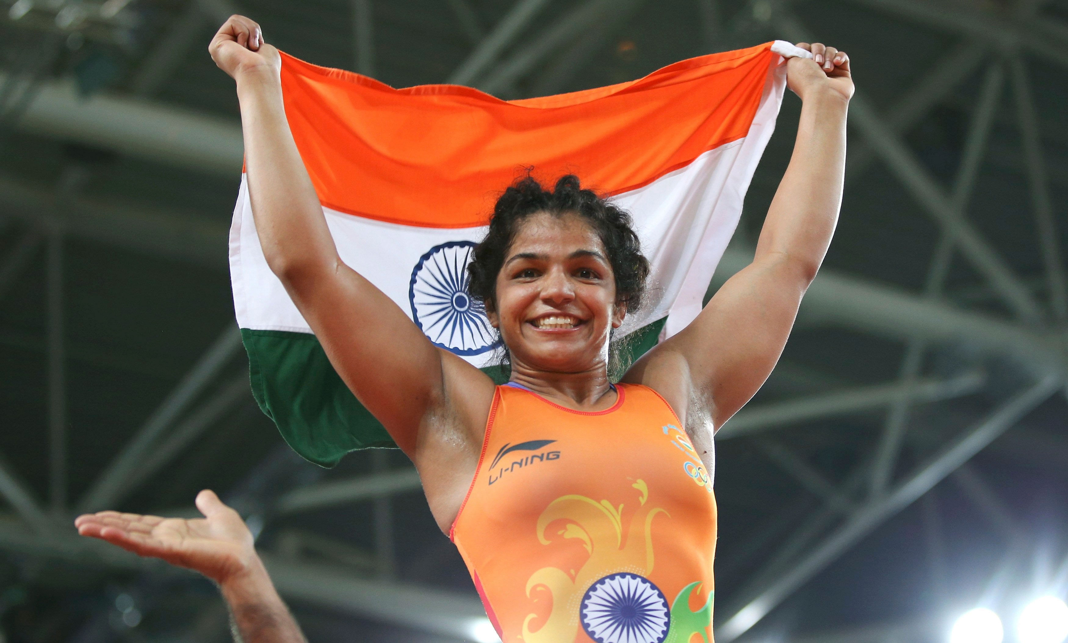 Sakshi Malik (IND) of India celebrates winning the bronze medal. REUTERS