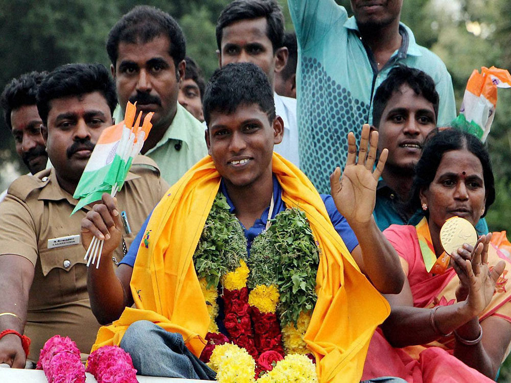  Thangavelu Mariyappan who won the gold in the Paralympics in Rio de Janeiro was given a rousing reception upon arrival at his residence in Salem on Saturday. PTI Photo