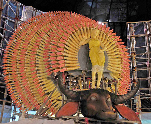 'Thousands Hands' Goddess Durga being prepared at a community puja pandal ahead of the Durga Puja festival in Kolkata on Monday. PTI Photo