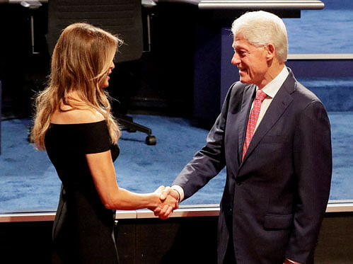 Former president Bill Clinton shakes hands with Melania Trump, wife of Donald Trump before the presidential debate at Hofstra University in Hempstead, N.Y., Monday, Sept. 26, 2016. AP/PTI