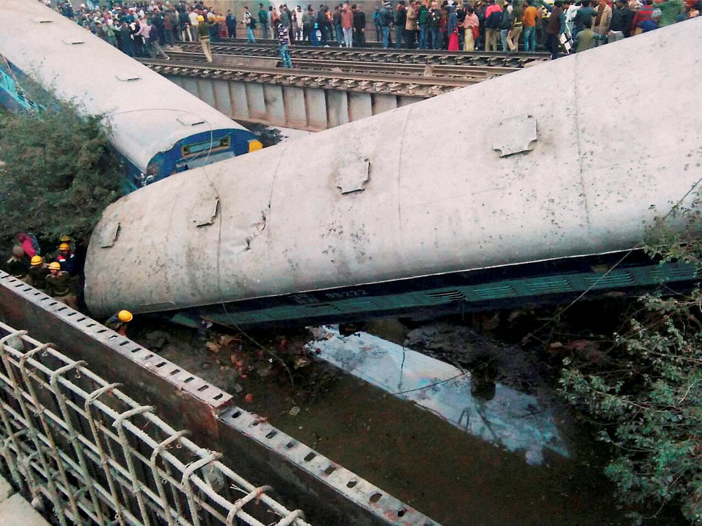 Rescue and relief work in progress at the site of accident where Ajmer-Sealdah express train derailed early morning near Rura railway station in Kanpur Dehat district in Uttar Pradesh on Wednesday. PTI photo