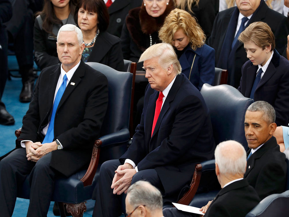 Incoming VP Pence, President-elect Trump, outgoing President Obama and outgoing VP Biden attend inauguration ceremonies swearing in Trump as the 45th president of the United States on the West front of the U.S. Capitol in Washington. Reuters