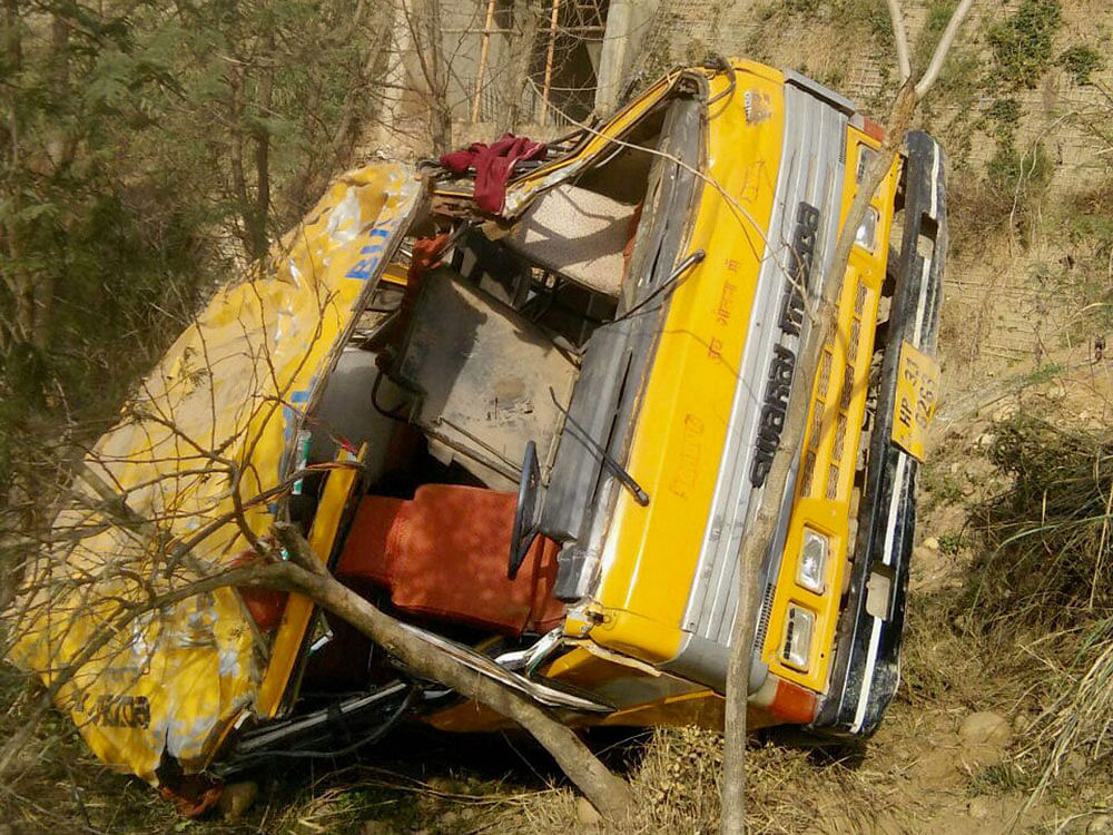 A school bus fell into a ditch while the driver was trying to overtake another bus near Dehar in Mandi district of Himachal Pradesh on Friday. 25 children were injured. PTI Photo