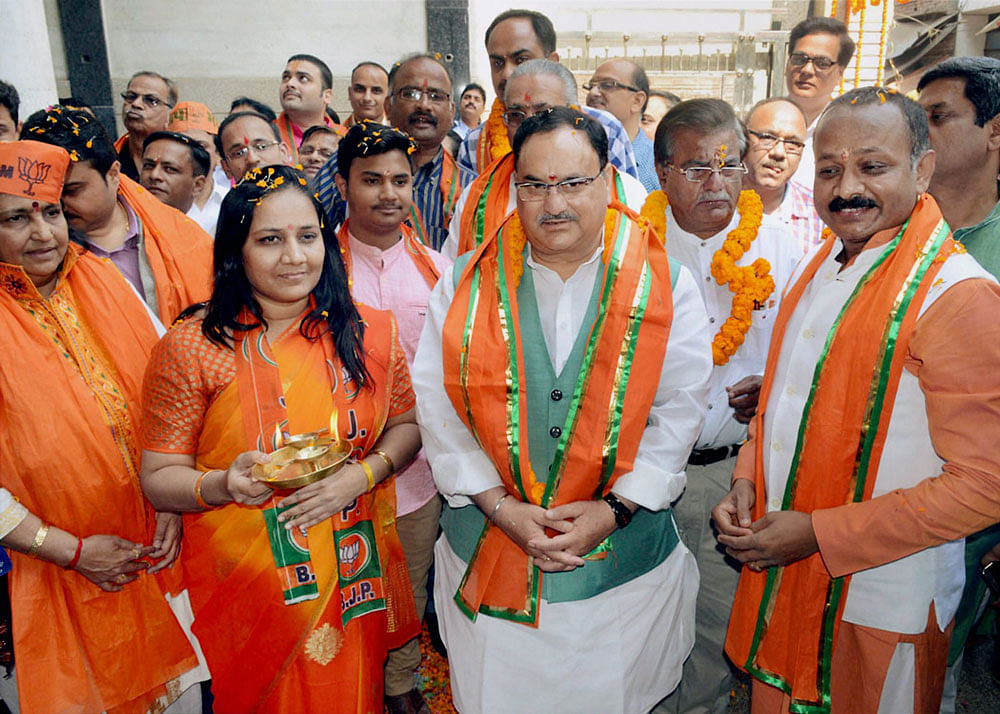 Union Health Minister and senior BJP leader J P Nadda along with UP party president Keshav Prasad Mourya during an election campaign in Varanasi on Friday. PTI Photo