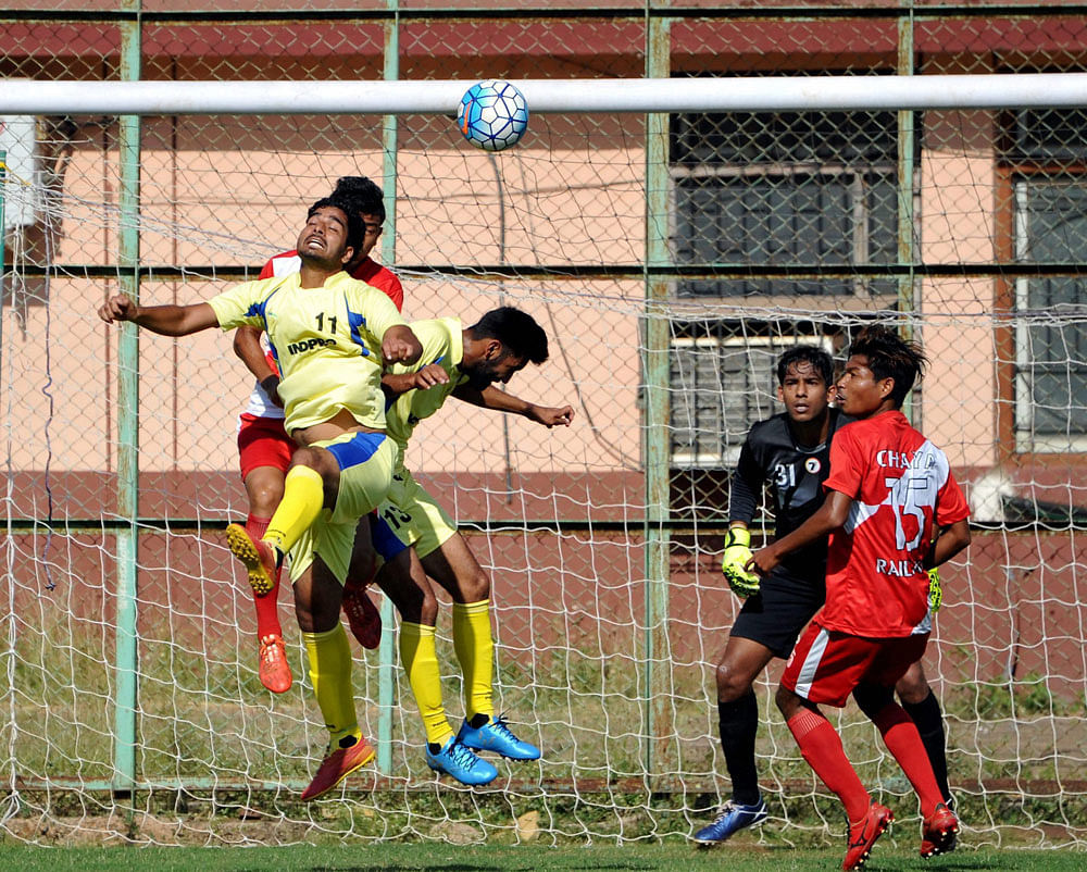Punjab and Railways players in action in the Santosh Trophy football match at Navelim, Goa on Monday evening. PTI Photo