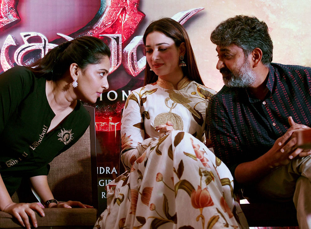 Actor Prabhas with actresses Tamannah Bhatia and Anushka at a press conference to formally launch the audio of 'Bahubali 2: The Conclusion' in Chennai on Sunday. PTI Photo