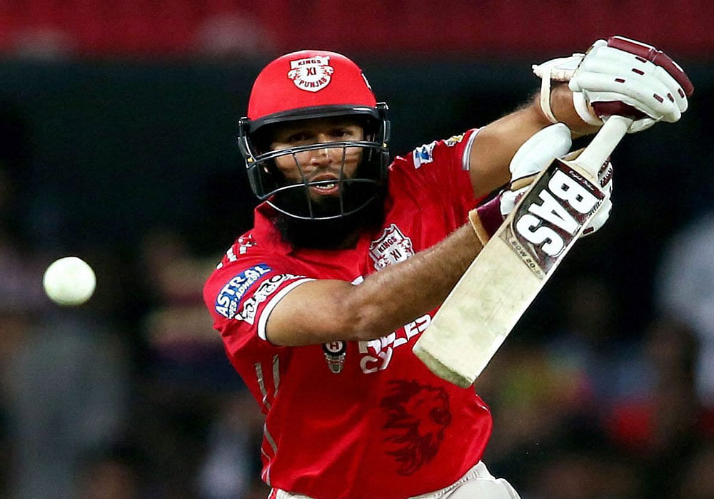 Hashim Amla of Kings XI Punjab plays a shot during Indian Premier League match against Mumbai Indians in Indore on Thursday. PTI Photo