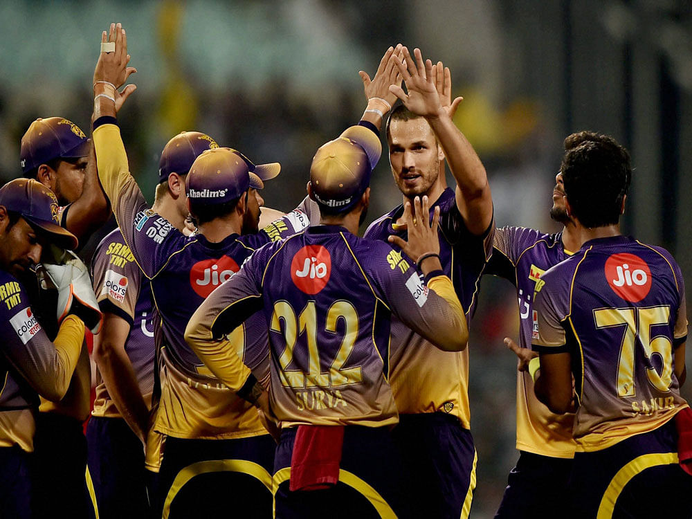  KKR bowler Coulter-Nile (C) jubilate with his teammates after dismissed Gujarat Lions batsman Aaron Finch during IPL Match against KKR in Kolkata on Friday. PTI Photo
