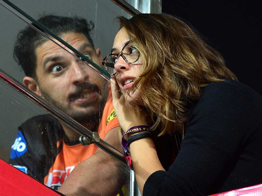 Sunrisers Hyderabad player Yuvraj Singh and his wife seen during the 2017 Indian Premier League (IPL) Twenty20 cricket match between Royal Challengers Bangalore and Sunrisers Hyderabad, at The M. Chinnaswamy Stadium in Bangalore on Tuesday. DH Photo/...