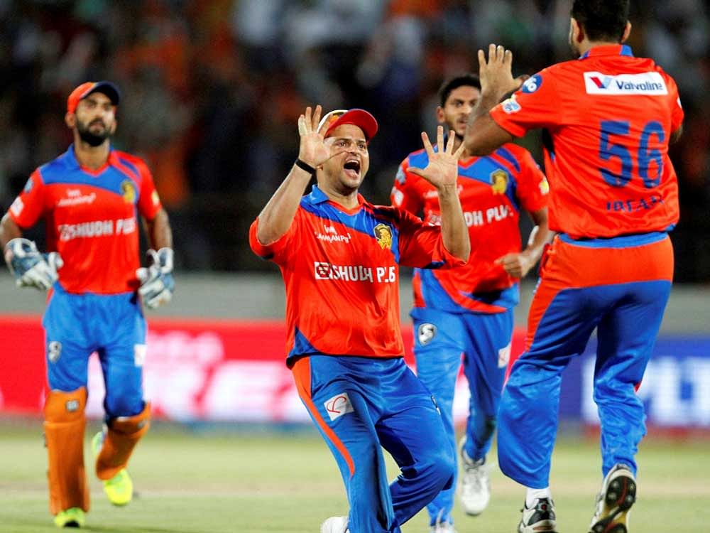 Gujarat Lions bowler celebrates the wicket of Mumbai Indians batsman Mitchell McClenaghan during the IPL T20 match played in Rajkot on Saturday.PTI Photo