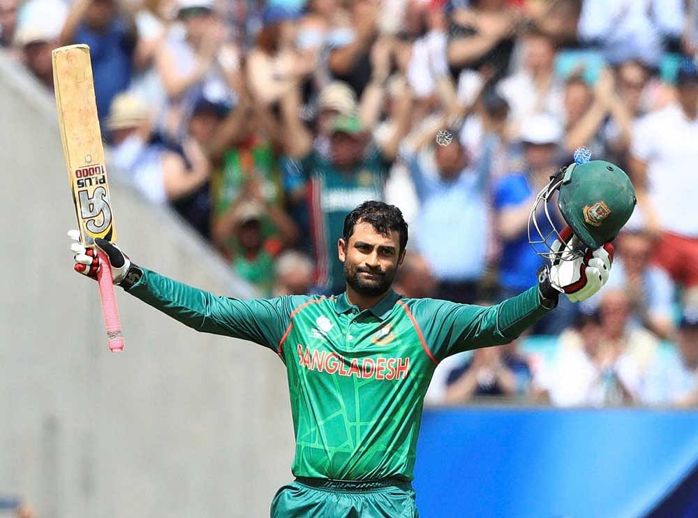 Bangladesh's Tamim Iqbal celebrates reaching his century during the ICC Champions Trophy cricket match between England and Bangladesh, at the Oval cricket ground, in London Thursday June 1, 2017. AP/PTI
