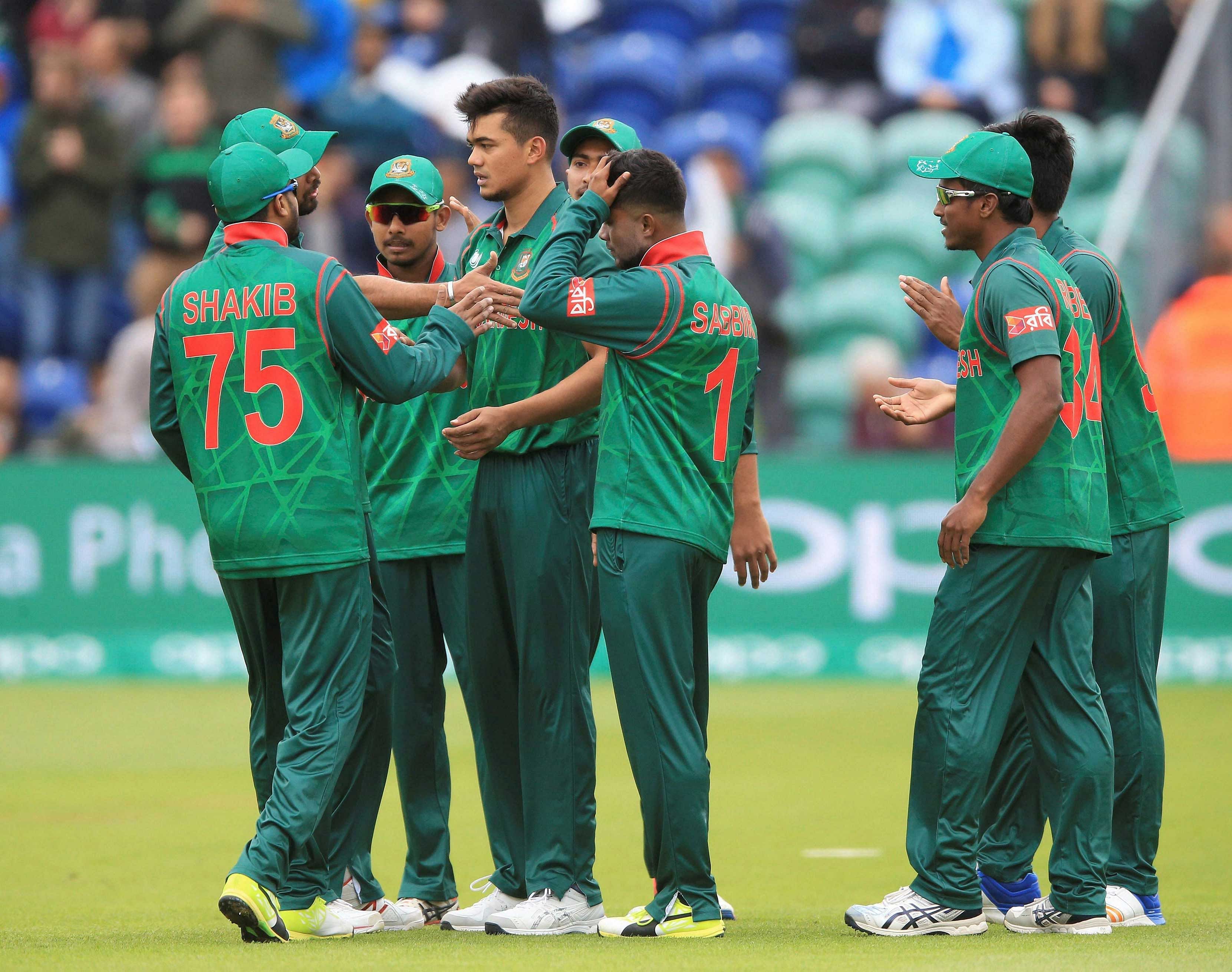 Bangladesh's Taskin Ahmed, centre, celebrates after taking the wicket of  New Zealand's Luke Ronchi during the ICC Champions Trophy, Group A  cricket match between New Zealand and Bangladesh, at Sophia Gardens,  Cardiff, Wales, Friday June 9, 2017