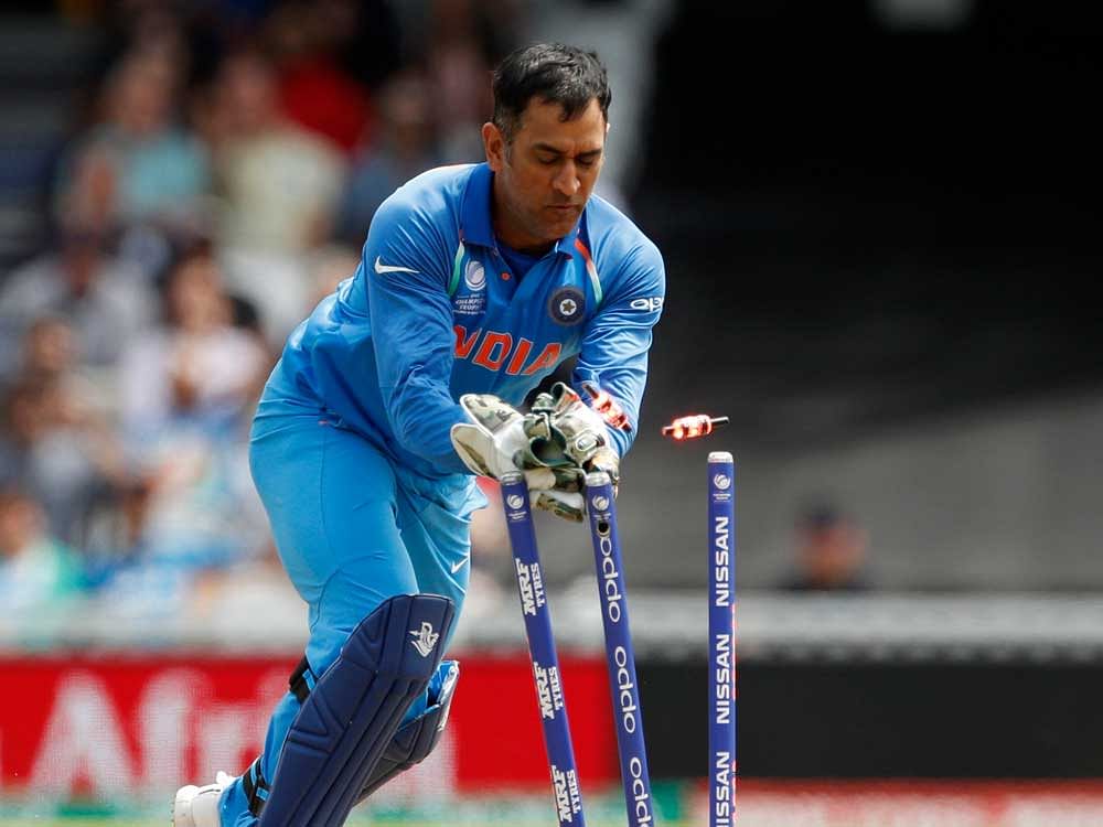 India's MS Dhoni as South Africa's Imran Tahir is run out