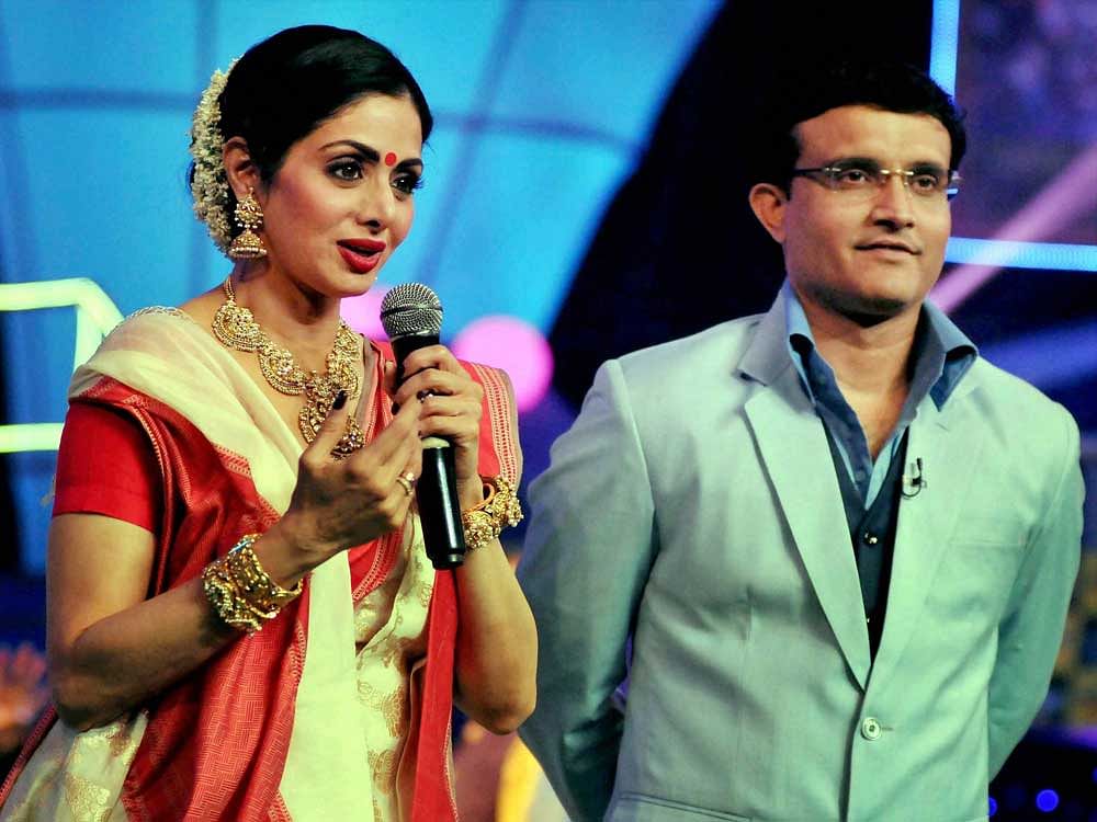 Bollywood actress Sridevi, in a traditional Bengali attire, speaks as former Indian cricket captain and CAB(Cricket Association of Bengal) President Sourav Ganguly looks on during a promotional event of her upcoming movie 'Mom' during the TV show 'Da...