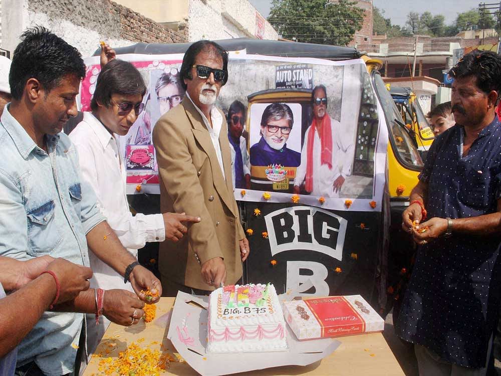 Actor Amitabh Bachchan's fans celebrate his 75th bithday in Jammu on Wednesday. PTI Photo