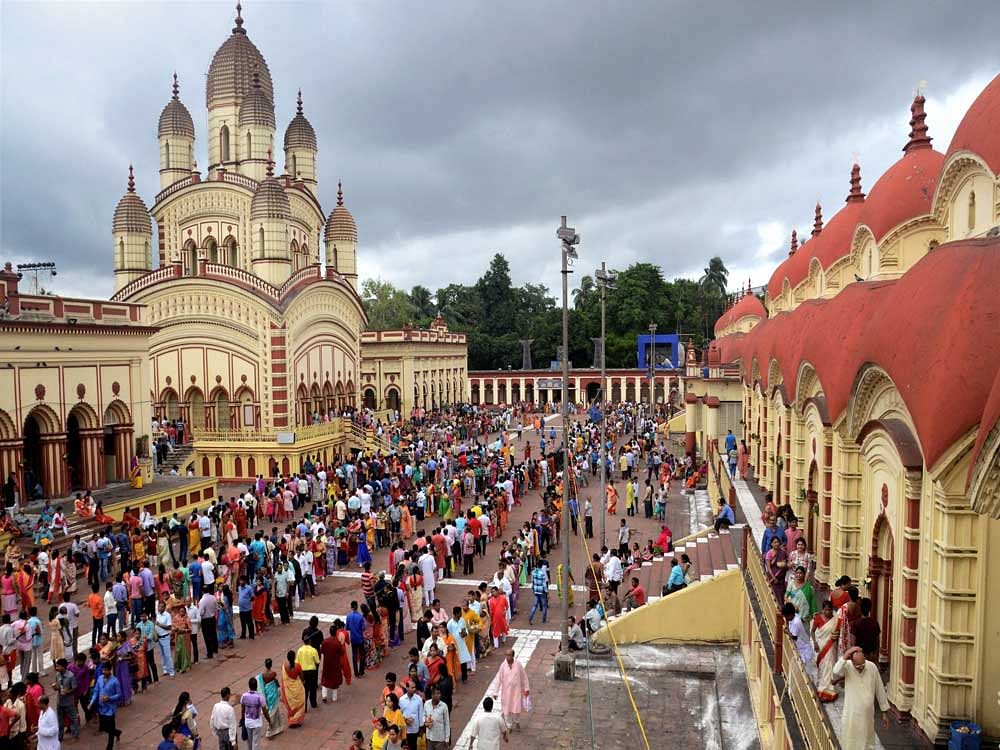 Devotees queued at Dakhheneswar Kali temple during Diwali festival in Kolkata on Thursday. PTI Photo